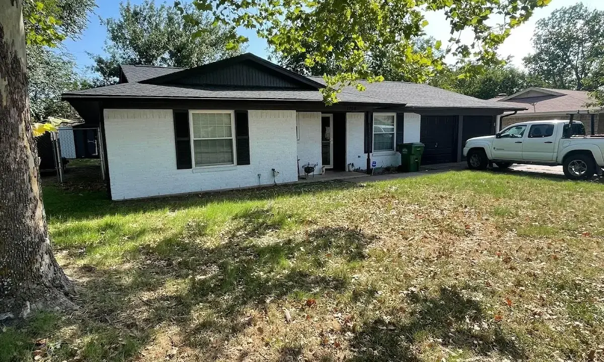 Professional roofing crew working on a residential roof in Stayton